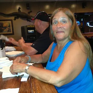 a woman sitting at a bar