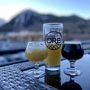 two glasses of beer on a table