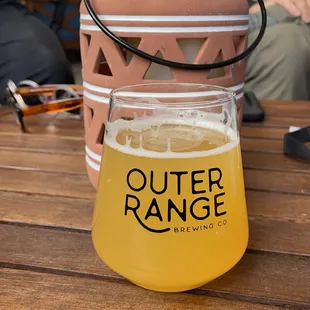 a glass of beer on a table