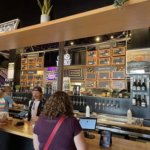 Bar area with all the available beers on 3 sizes or you can grab a sixer out of the cooler.