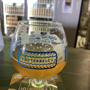 a glass of beer on a table
