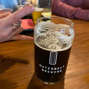a pint of beer on a table