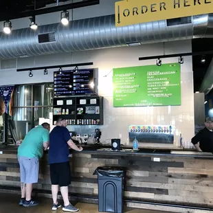 two people standing at the counter