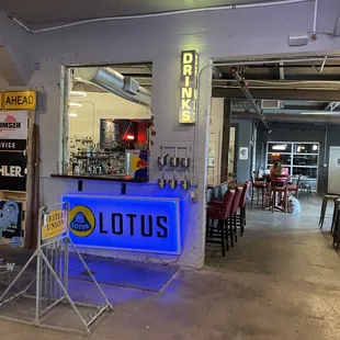 a bar with neon signs