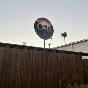 a sign on a wooden fence