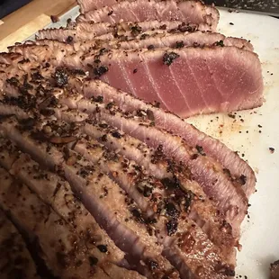 sliced steak on a cutting board