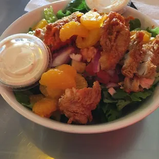 The house salad with fried tenders tossed in free bird sauce ( spicy) and jalapeño ranch dressing is awesome