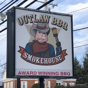 a sign for outlaw bbq