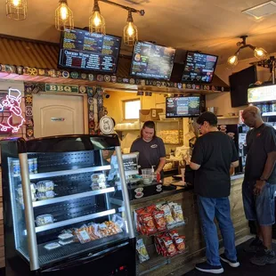 Cashier counter is neat and organized. But menus are everywhere takes some time to read
