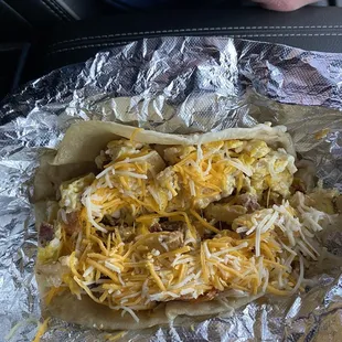 Excellent breakfast burrito. Bacon, eggs, potato and cheese.