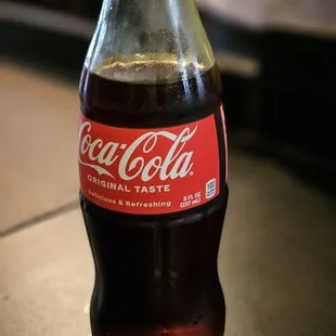 a coke bottle on a counter