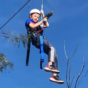 This little man ran the zipline several times before he got on our sharpshooters club!