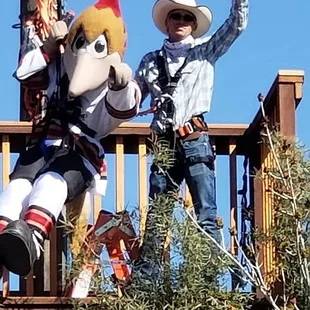 The Tucson Hockey Teams Roadrunner getting ready for a thrilling shoot-em-up experience on Outlaw Zipline!