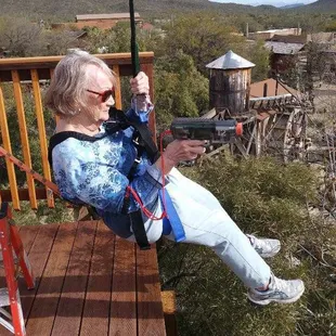 90 year old great-grandmother shooting her way down Outlaw Zipline...again!