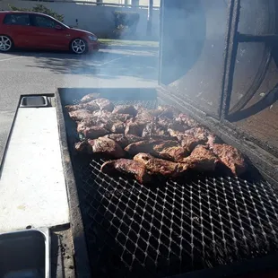 a grill with meat on it