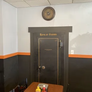 a black door and a brown table