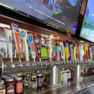 a row of beer taps