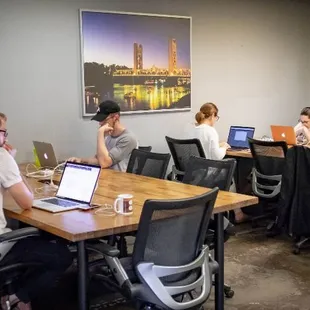 Coworking members in the back flex space at Outlet Coworking