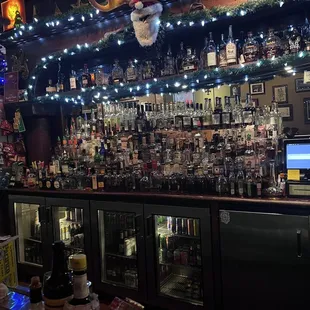 a bar filled with bottles of liquor