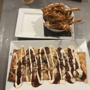 Pork belly Flatbread with a ranch drizzle and a mini poutine