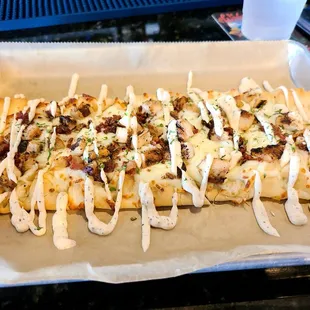 My favorite: flatbread topped with mozzarella cheese, chicken, bacon and a drizzle of ranch. YUM!