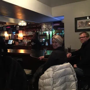 people sitting at the bar