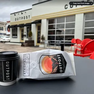 Bag of whole beans and a chai latte to go.