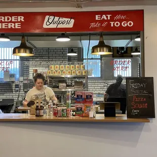 a woman behind the counter