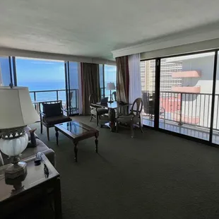 Corner Ocean Front Suite: Living Room with Sofa Bed