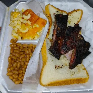 Dry tough me knee seasoning, slightly burnt dry macaroni cheese and horrible beans