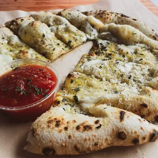 a slice of pizza with a side of ketchup