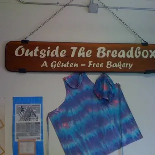 a wooden sign hanging on a wall