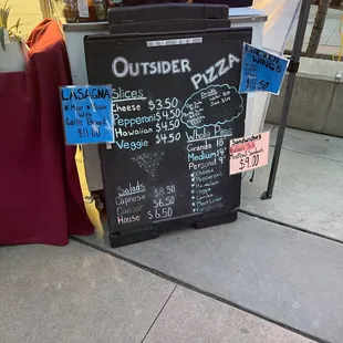 a blackboard with a price list on it