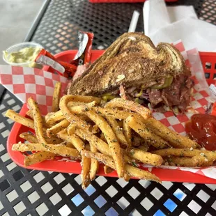 The hot Rueben with butter garlic fries