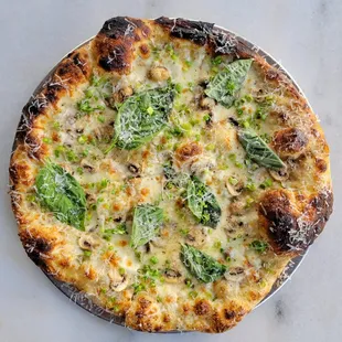 a cheese and broccoli pizza