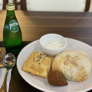 a plate of food and a bottle of water