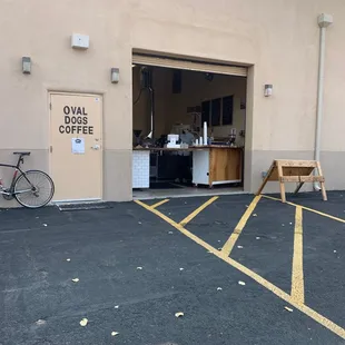 a bicycle parked in front of a coffee shop