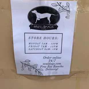 a sign for the store hours