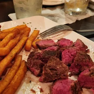 Filet mignon with fries and cucumber mint fizz