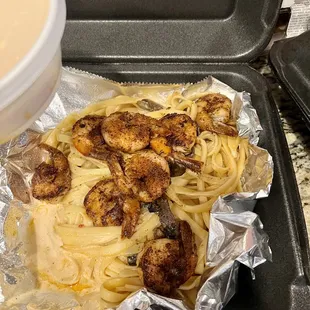 a pan of pasta and shrimp