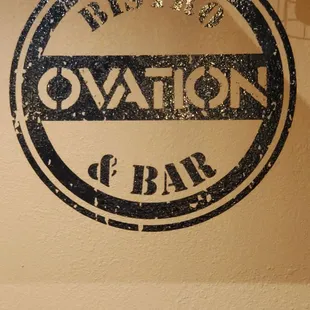 Logo, on wall by the bar