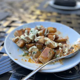 Patatas Bravas (roasted garlic aioli, bravas sauce)