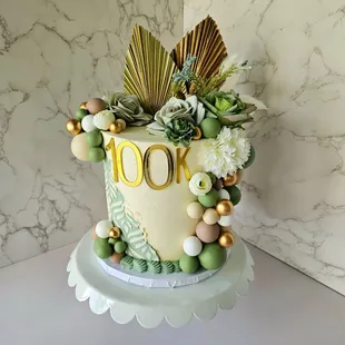 Sage, gold, and beige celebration cake.