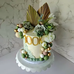 Sage, gold, and beige clebration cake.