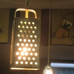 a grater hanging from the ceiling