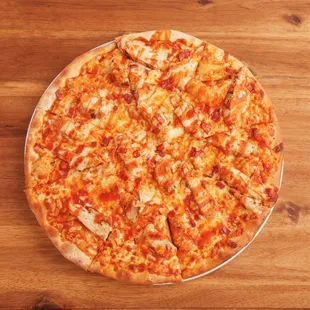 a pizza on a wooden table