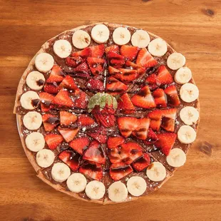 sliced strawberries, bananas, and chocolate