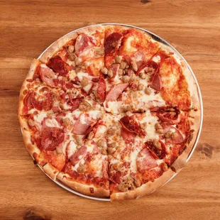 a pepperoni, ham, and cheese pizza