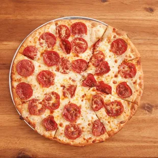 a pepperoni pizza on a pizza pan