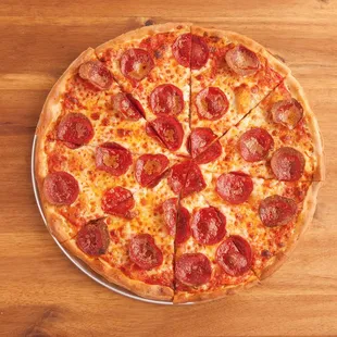 a pepperoni pizza on a wooden table